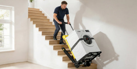 Washing machine secured to an electric stair climbing dolly while being moved on residential stairs