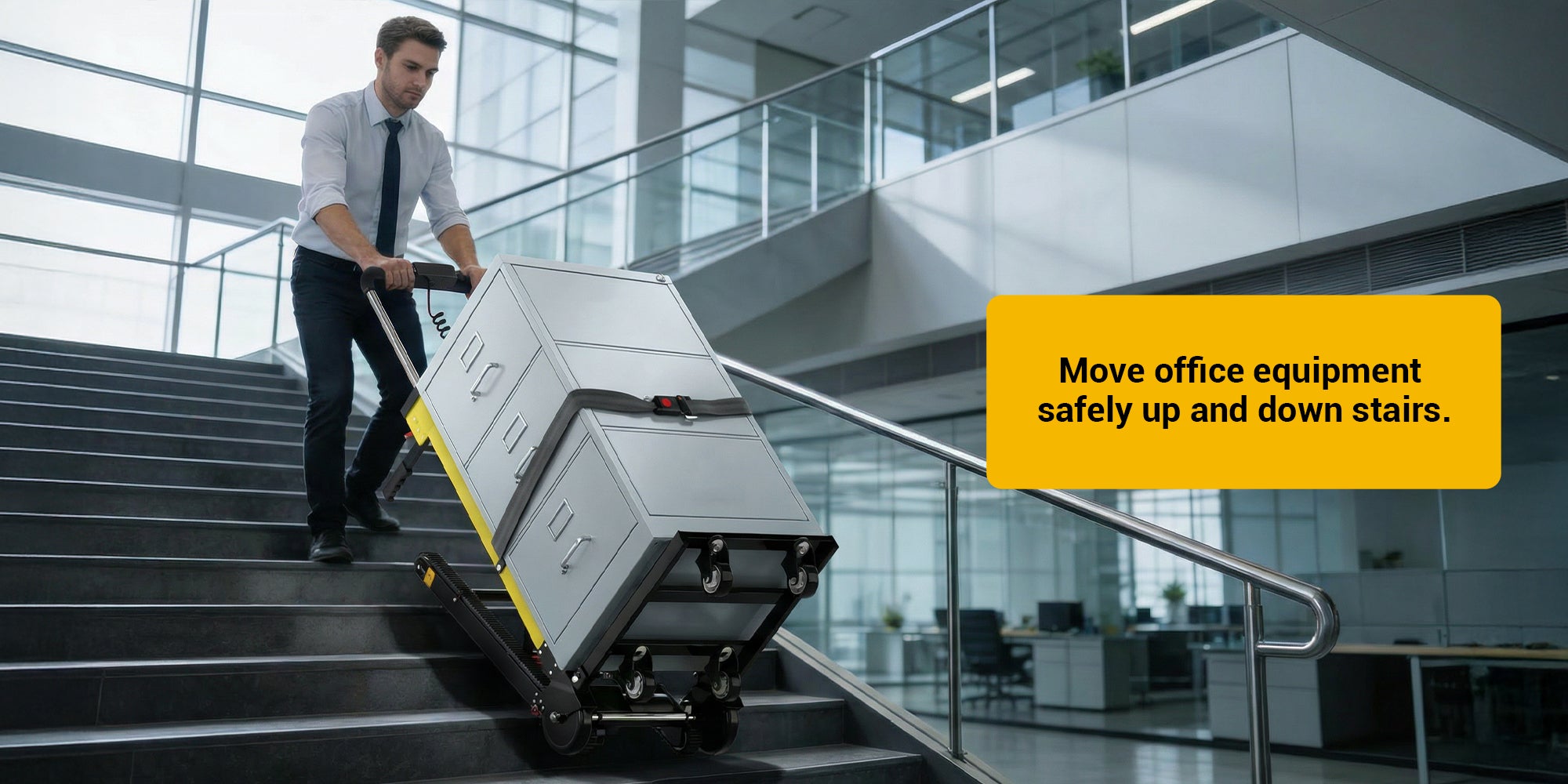 Riosoc Electric Stair Climbing Hand Truck transporting a heavy filing cabinet up office stairs. Ideal for moving bulky items with ease, featuring a 441 lbs load capacity and anti-slip tracks.
